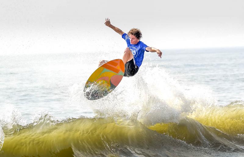 Dewey Beach’s Ethan Redefer slams off a wave and wins his first heat during the pro competition in the 2021 Zap Pro/Am World Championships of Skimboarding. DAN COOK PHOTO